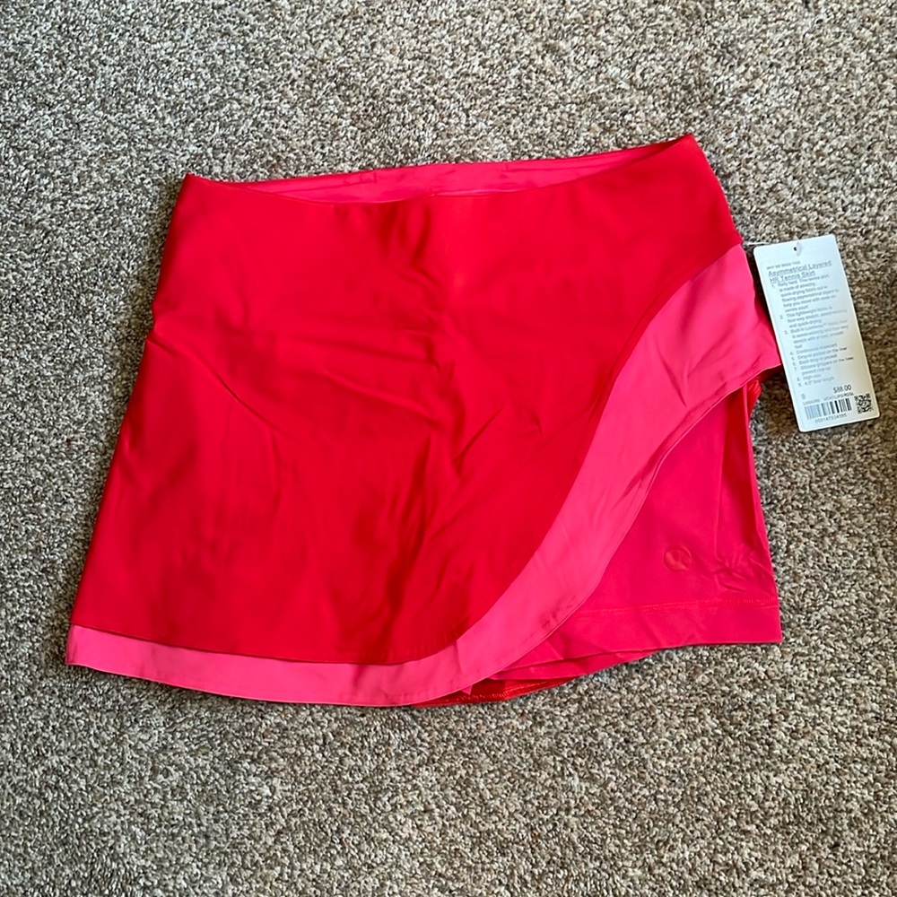 Lululemon asymmetrical layered HR tennis skirt, size 8, in hot heat/lip gloss